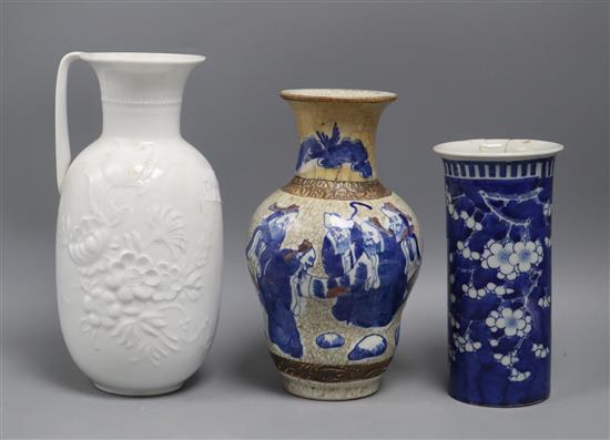 A blue and white sleeve vase, a Chinese crackleware vase and a Kaiser vase tallest 26cm